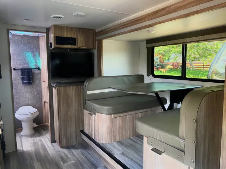 Dinette that slides out and also converts to a full size bed.. Winnebago Micro Minnie 2021
