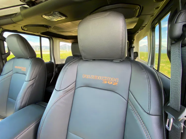 Jeep Rubicon 392 interior: black leather seats with orange "RUBICON 392" branding. Scenic mountain views, great for your rv rental trip.. Jeep Wrangler Unlimited Rubicon 392 2021