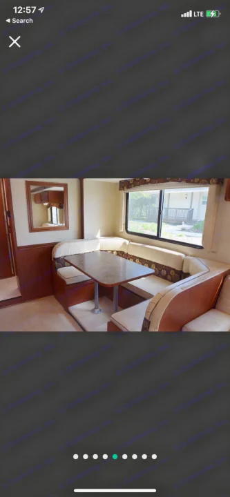 RV rental interior: comfy U-shaped dining booth, table, and large window. Perfect for road trip meals.. Winnebago Minnie Winnie 2015