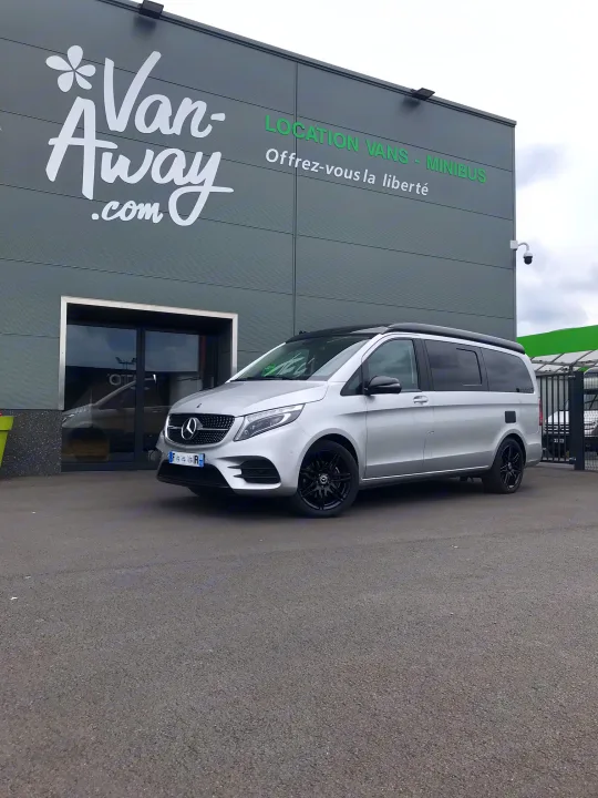 A silver Mercedes van parked at Van-Away.com, a rental service for vans, minibuses & RVs. Start your journey!. Mercedes MARCO POLO 2023