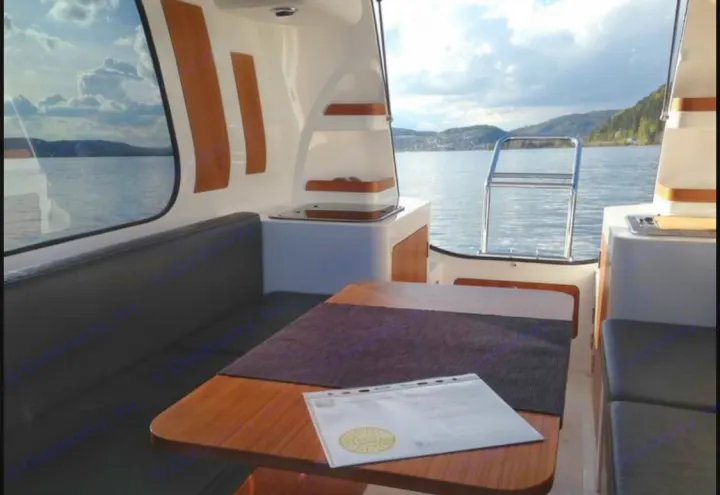 Cozy boat cabin view of a calm lake. Perfect for water-based leisure, similar to an RV rental adventure.. Sealander Sealander 2021