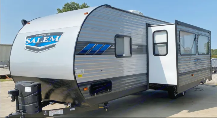 Ready for adventure: A modern, light grey Forest River Salem travel trailer with an extended slide-out, ideal for rv rental.. Forest River Salem 2021