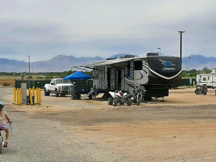 This photo shows the RV in use with all slides, awnings and toys out.  . Jayco Seismic 2015