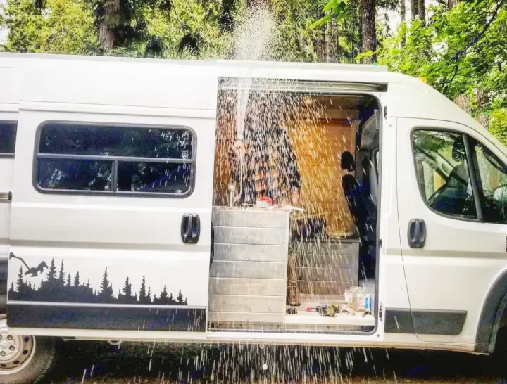 Experience outdoor showers in an RV rental! This custom camper van offers a refreshing mobile bathing solution amidst nature.. Dodge Ram Promaster 2500 2019
