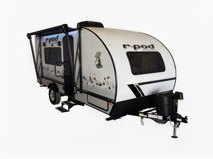 White r-pod travel trailer, ideal for rv rental adventures. Features an extended awning and entry steps.. Forest River R-Pod 2022