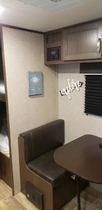 This RV rental interior features a cozy dinette, bunk beds, and control panel, ready for your next adventure.. Jayco Jay Flight 2021