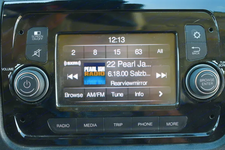 RV rental car infotainment system showing Pearl Jam Radio, time 12:13, and various controls like volume, screen, and media options.. Other Other 2021
