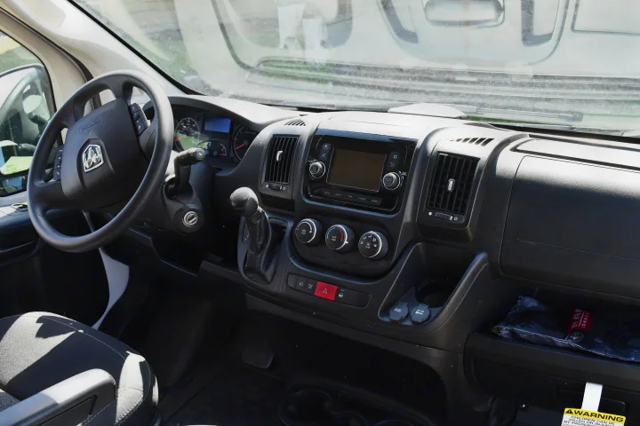 Ram ProMaster RV rental interior: detailed dashboard with steering wheel, infotainment, and controls.. Other Other 2021