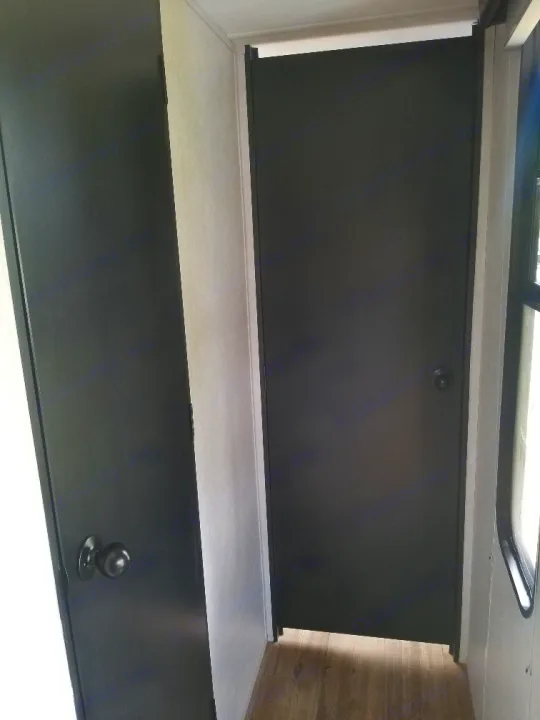 Outside door to  bathroom and bedroom with locks. Forest River Cherokee Grey Wolf Black Label Toy Hauler 2021