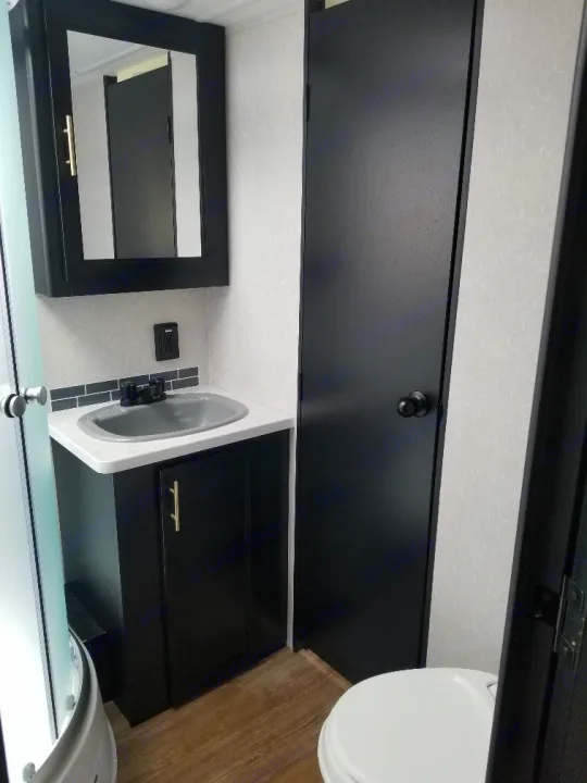 dual door from bathroom to bedroom with locks . Forest River Cherokee Grey Wolf Black Label Toy Hauler 2021