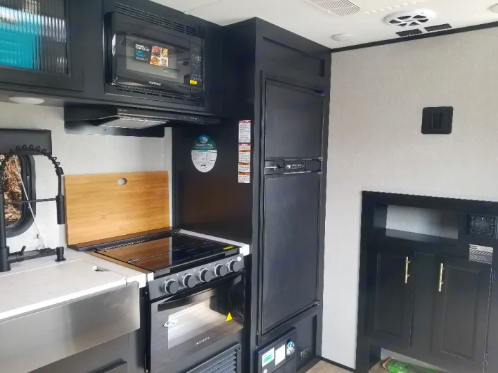 Stove , microwave , 32 inch tv with netflix and roku etc. Forest River Cherokee Grey Wolf Black Label Toy Hauler 2021