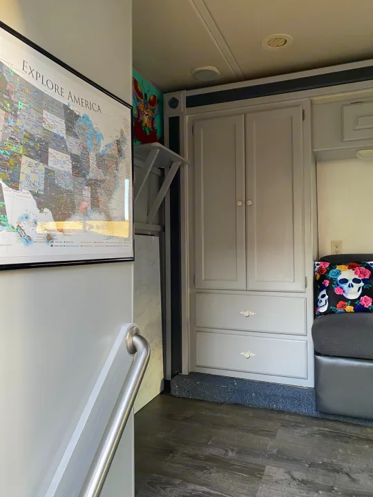 This RV rental interior offers clever storage, comfortable seating with fun decor, and an "Explore America" travel map for your next adventure.. Holiday Rambler Atlantis 2002