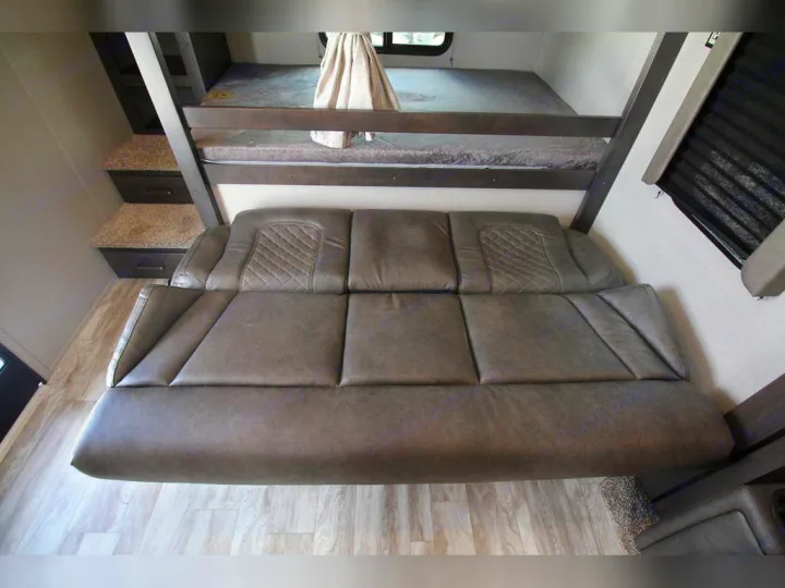 RV rental: Convertible sofa, bunk beds, and built-in storage steps. Functional and comfortable RV interior.. Grand Design Transcend Xplor 2021