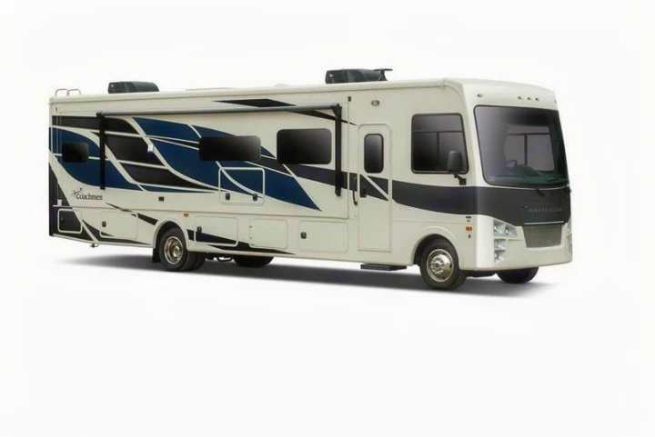 White Coachmen Mirada Class A motorhome with blue and black graphics, ideal for your next rv rental journey.. Coachmen Mirada A-Class 2022