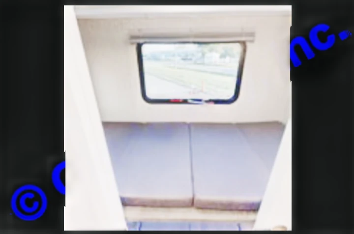 RV rental interior: A cozy sleeping area with two mattresses and a window showing the outdoors, perfect for camping trips.. Coachmen Mirada A-Class 2022