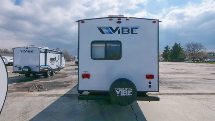Rear view of a white Forest River Vibe travel trailer. Explore this RV rental option for your next adventure.. Forest River Vibe 2021