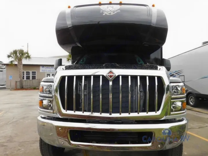 Front view of a black Nexus RV motorhome with a chrome grill, ideal for rv rental. Ready for your next adventure!. Nexus Rebel 2022
