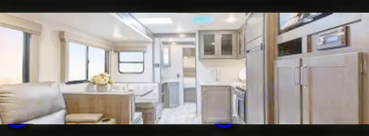 Comfortable rv rental interior: spacious living area, dinette, and well-appointed kitchen. Perfect for adventures!. Grand Design Other 2021
