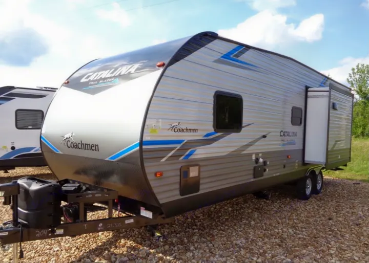 A sleek Coachmen Catalina Trail Blazer travel trailer, ideal for an RV rental or your next camping adventure.. Coachmen Catalina 2021