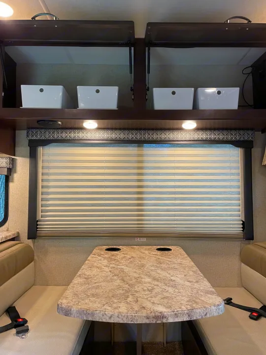 Large storage above with bins to keep everything organized and in its place .. Thor Four Winds 2020