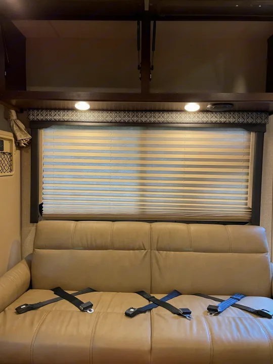 Lots of storage in cabinets above and three seat belts for the road.. Thor Four Winds 2020
