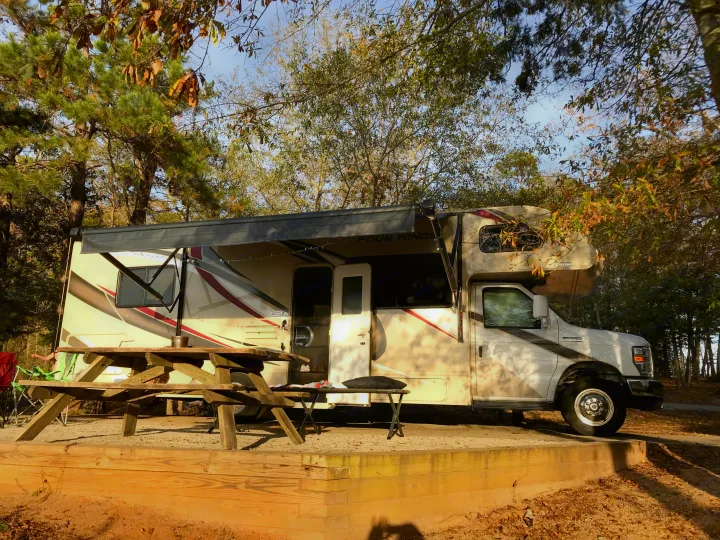 Power awning keeps sun and rain off.  Lots of outside storage in rear 'basement.'. Thor Four Winds 2020