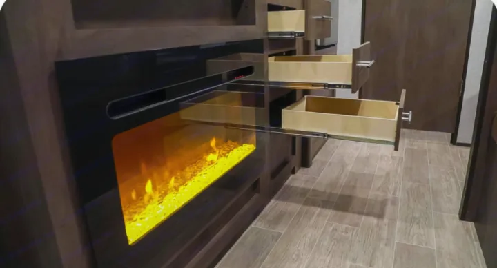 RV rental: Modern interior with a bright electric fireplace and multiple open storage drawers for convenience.. Coleman COLEMAN LANTERN 2021