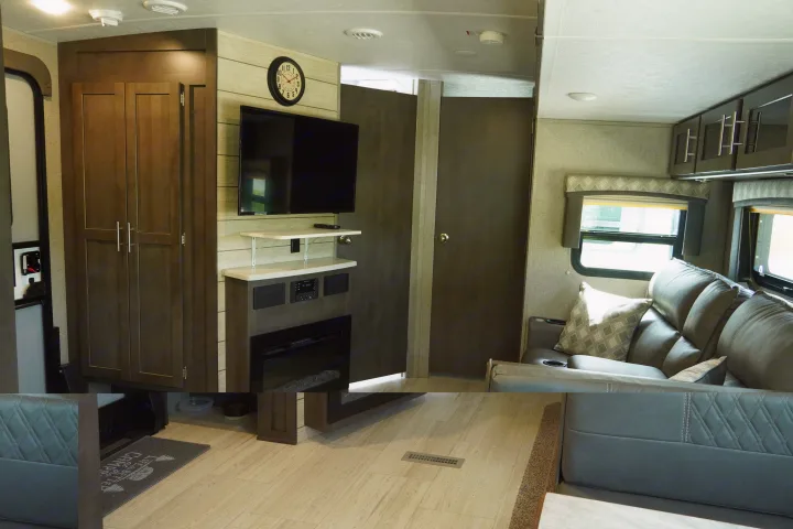 Modern RV rental interior: living area with recliners, TV, fireplace, and ample storage. Ideal for travel comfort.. Forest River Flagstaff Super Lite 2021
