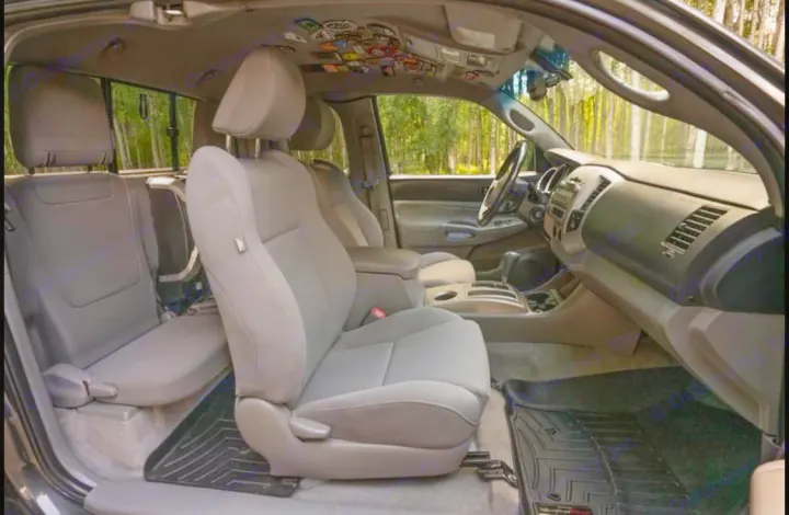 Spacious truck interior with gray seats & WeatherTech mats, ready for adventure. A practical choice for your RV rental alternative.. Toyota Other 2010