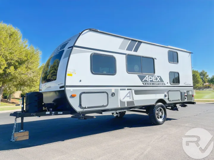 Light-colored Apex Nano Off Grid travel trailer. Rent this RV for your next outdoor adventure.. Coachmen Apex 2021