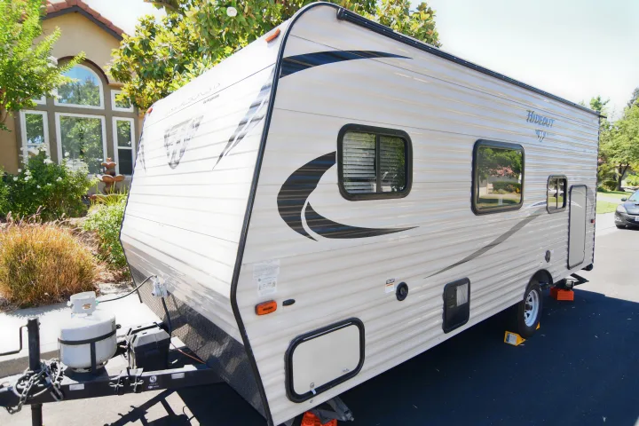 Explore the open road! This travel trailer RV rental, with propane & leveling gear, awaits your next getaway.. Keystone RV Hideout 2017