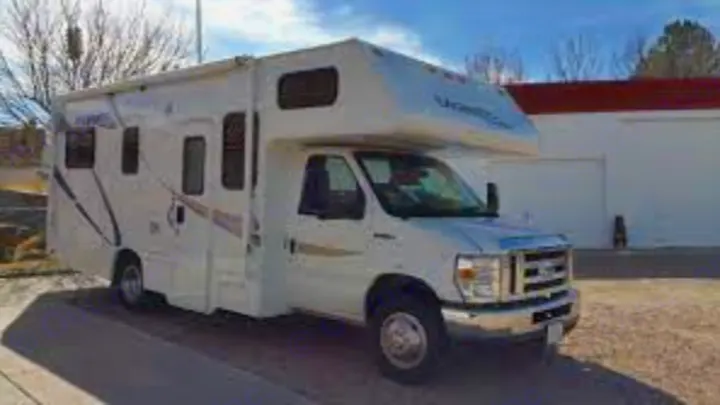 White U-Haul Class C RV for rv rental. This versatile vehicle is parked, ready for your next adventure.. Thor Motor Coach Four Winds Majestic 2013