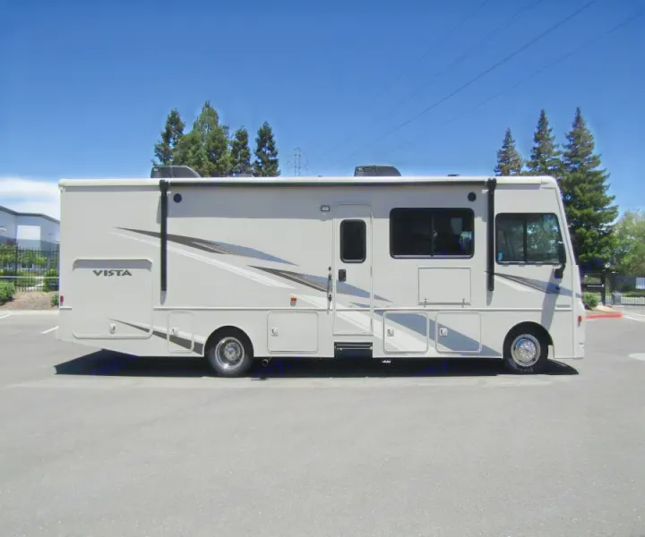 Spacious grey Winnebago Vista Class A RV motorhome, ideal for your next RV rental adventure.. Winnebago Vista 2022