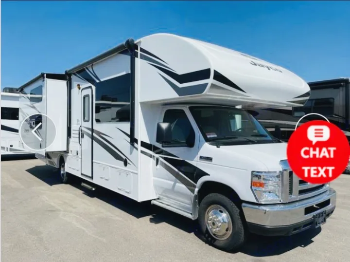 White Class C RV rental, perfect for travel adventures. Features extended side slide-out & black/gray graphics.. Jayco Redhawk 2018
