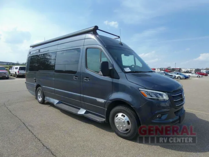 Dark gray Mercedes Sprinter RV rental van with awning, parked outside.. Winnebago Era 2021