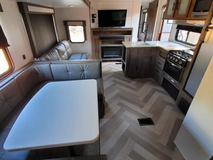 Modern RV rental: U-shaped dinette, full kitchen, fireplace, & herringbone floor.. Forest River Salem 2021