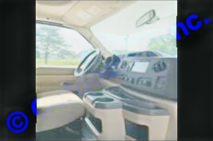 RV rental: Inside a spacious camper van cab, showing the dashboard, steering wheel, and front seats, ready for your road journey.. Thor Motor Coach Freedom Elite 2019