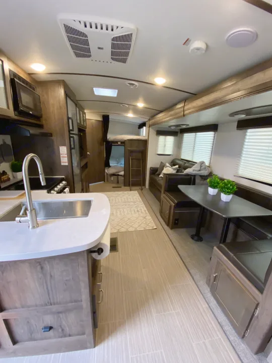 Spacious interior setup with double bunks. Keystone Passport 2021
