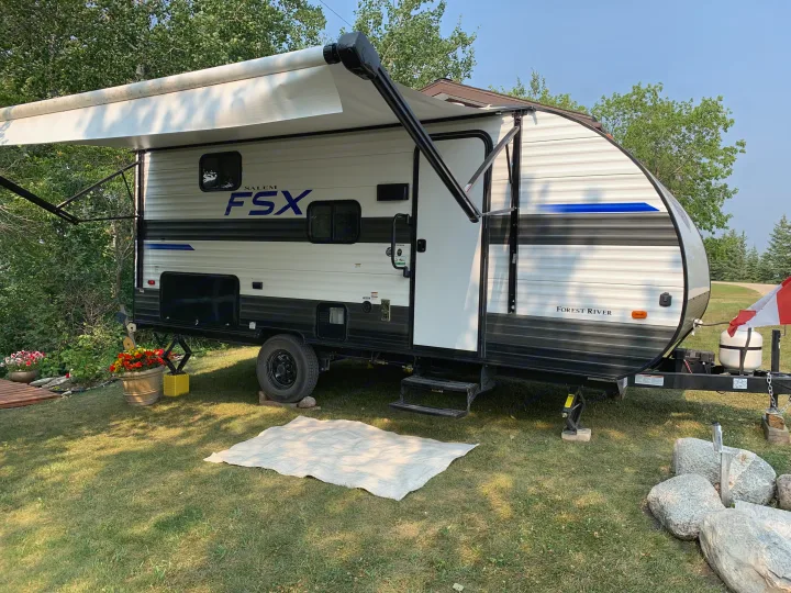 Explore the outdoors! A Forest River Salem FSX travel trailer with an extended awning, ready for your next RV rental adventure.. Forest River Salem 2021