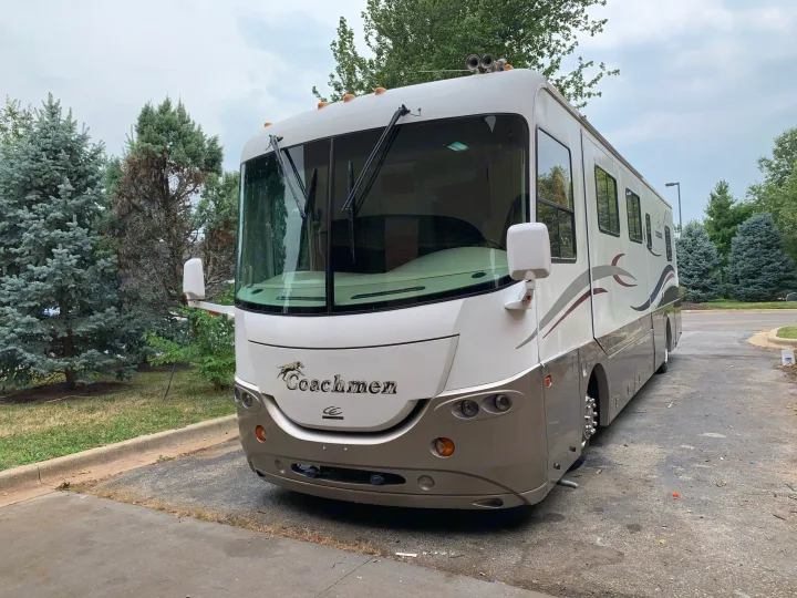 Coachmen RV rental: a spacious motorhome parked outdoors, ready for your next travel adventure.. Coachmen Cross Country 2003