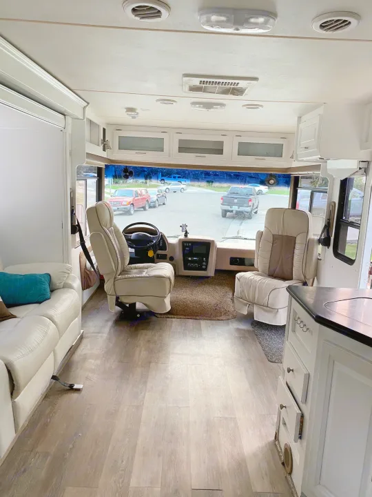 Spacious and modern RV rental interior showing driver's area, kitchen, and living space. Perfect for your next road trip adventure.. Forest River Georgetown 2011