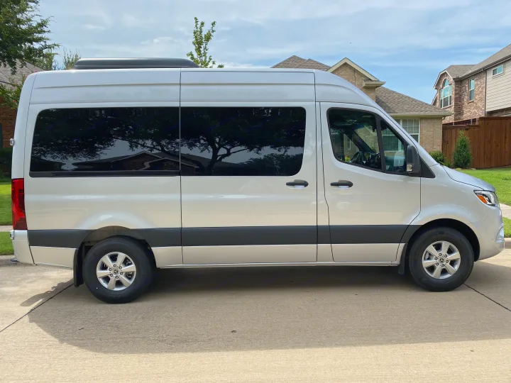 A silver Mercedes-Benz Sprinter van, excellent for rv rental, parked on a paved driveway.. Mercedes-Benz Sprinter 2021