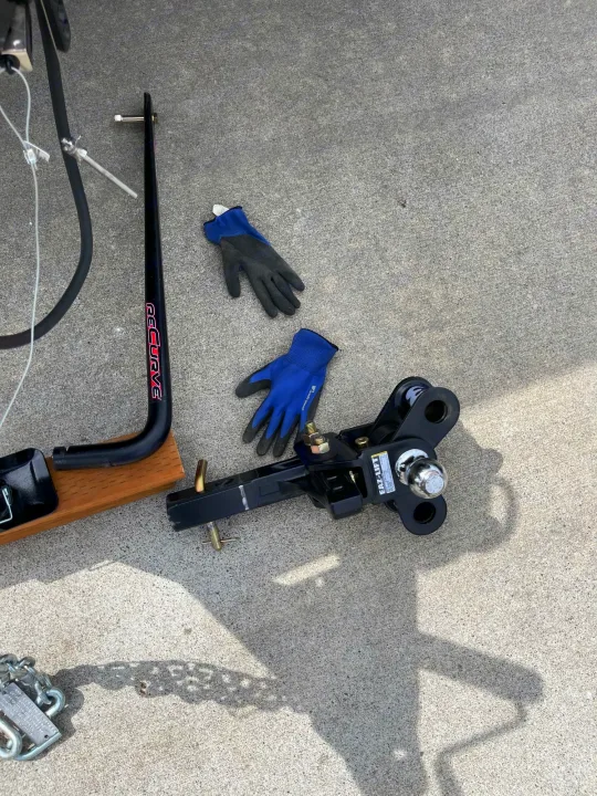 RV rental: EAZ-LIFT Recurve weight distribution hitch parts and gloves shown on concrete, ready for towing.. Other Other 2021