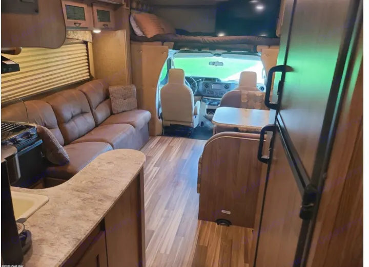 Spacious RV rental interior featuring living, dining, kitchen, and sleeping areas. Ideal for comfortable travel.. Coachmen Freelander 31BH 2017