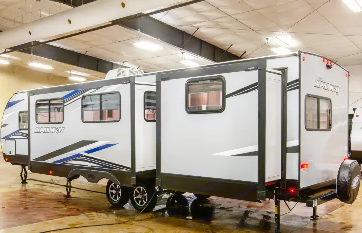 Spacious Alpha Wolf travel trailer RV rental with extended slide-outs, perfect for your next adventure or camping trip.. Forest River Cherokee Wolf Pack 2021