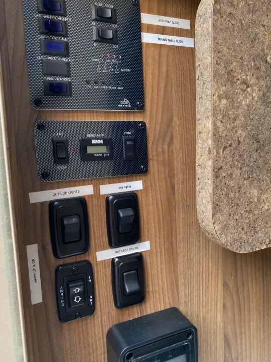 RV rental control panel with switches for generator, water heater, slides, tanks, and lights, offering full control.. Coachmen Prism 2016