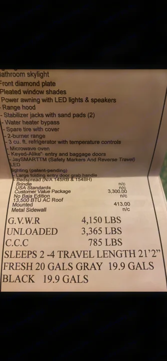 Printed RV rental specifications list including weight, sleeping capacity, tank sizes, and features for a travel trailer.. Jayco Jay Flight 2021
