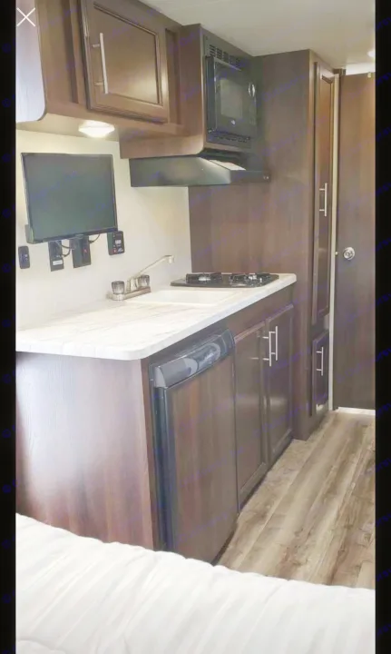 Sink, stove top and TV.. Jayco Jay Flight 2019