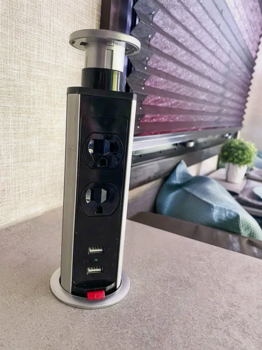 This RV rental offers a pop-up power tower with AC outlets and USB ports for charging devices, built into the countertop.. Entegra Coach Other 2022