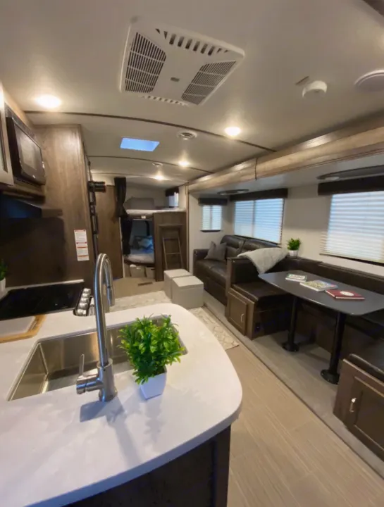 Spacious interior setup with double bunks. Keystone Passport 2021